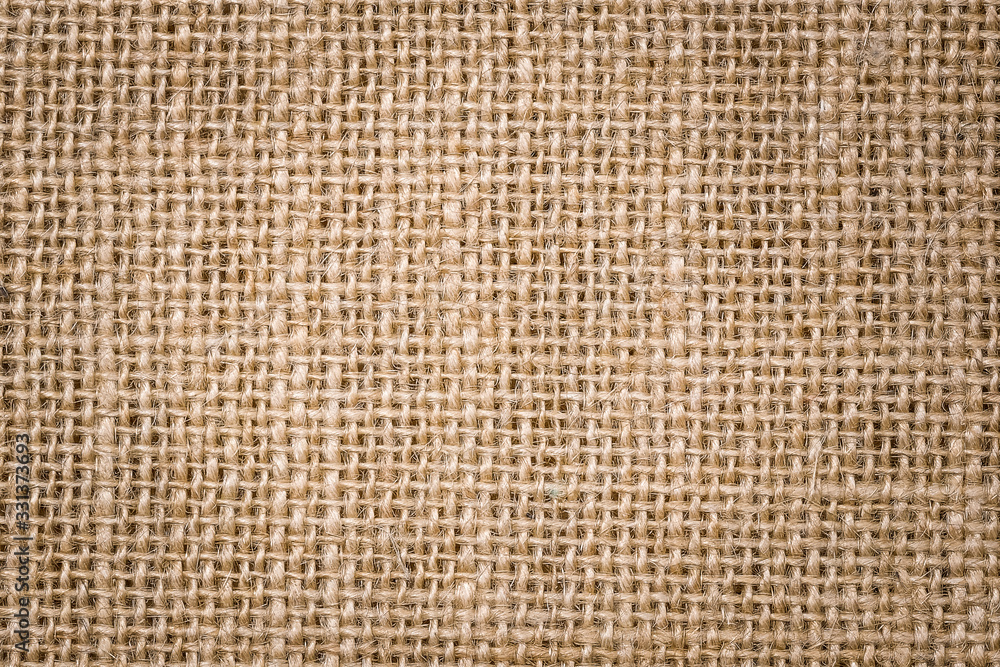 Rough hessian background with flecks of varying colors of beige and brown. with copy space. office desk concept, Hessian sackcloth burlap woven texture background. Rough hessian background with flecks of varying colors of beige and brown. with copy space. office desk concept, Hessian sackcloth burlap woven texture background.