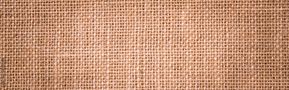 Rough hessian background with flecks of varying colors of beige and brown. with copy space. office desk concept, Hessian sackcloth burlap woven texture background. Rough hessian background with flecks of varying colors of beige and brown. with copy space. office desk concept, Hessian sackcloth burlap woven texture background.