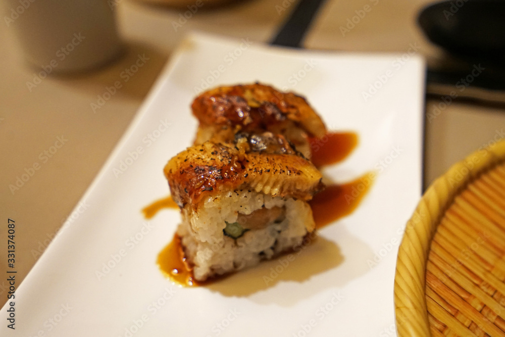 Close up Unagi, Japanese Grilled eel fish sushi rolls Close up Unagi, Japanese Grilled eel fish sushi rolls