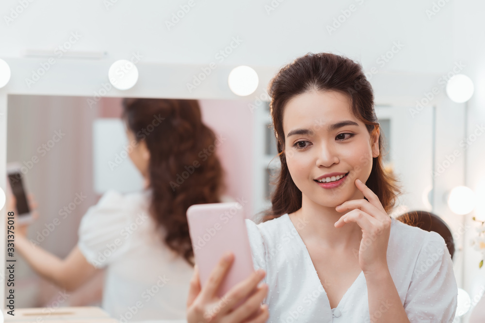 beauty asian woman makeup and take selfie in mirror beauty asian woman makeup and take selfie in mirror