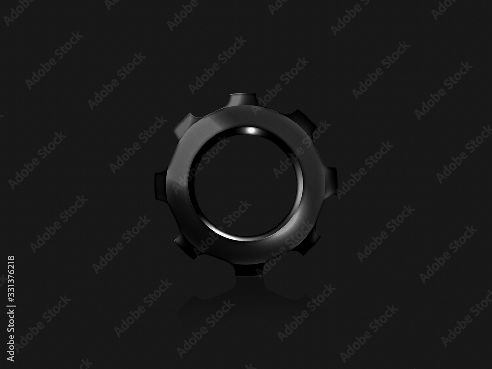 Black gear on a black textural background