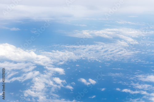 Beautiful cloudscape,view over white fluffy clouds, freedom concept