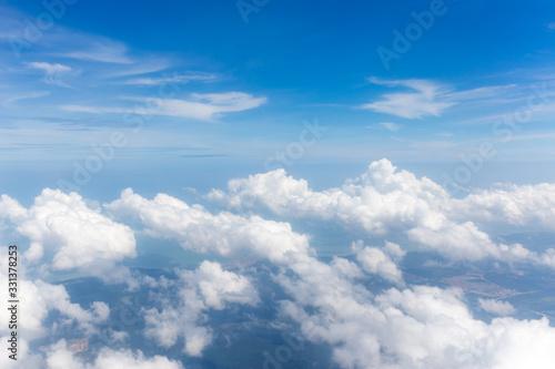 The big white fluffy clouds in the blue sky, beautiful cloudscape.