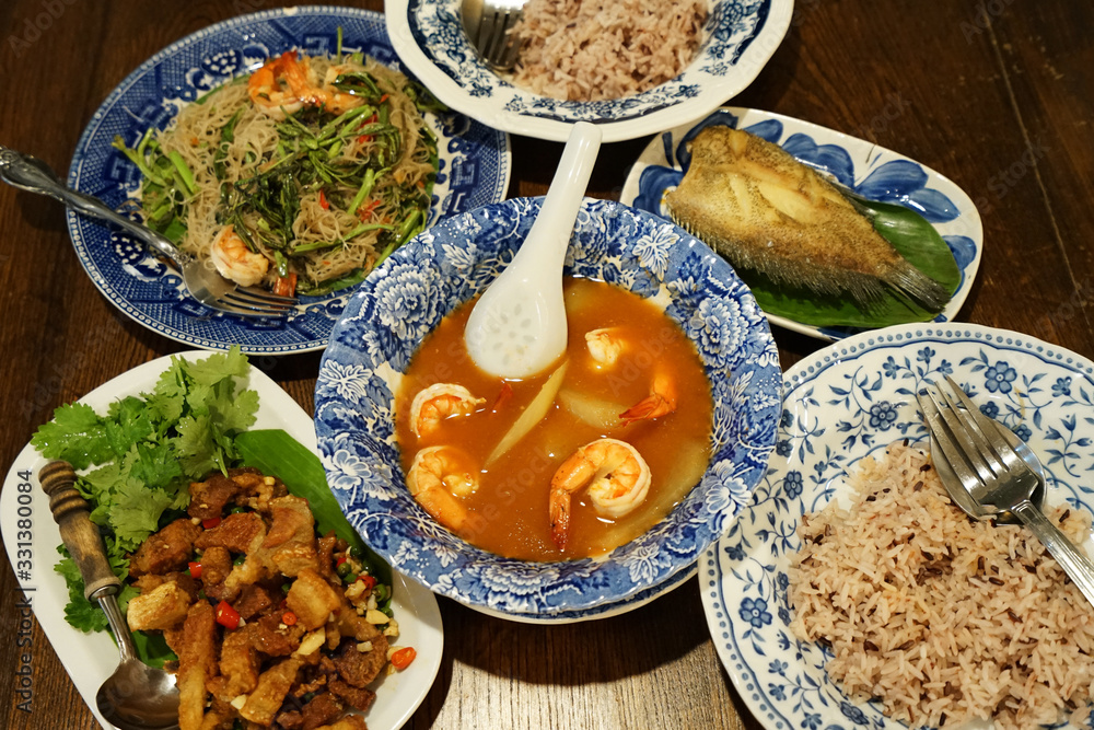 Shrimp sour curry soup served with deep fried Gourami(Gouramy) fish, brown rice, Streaky pork, Stir fry spicy rice vermicelli noodles with prawn and water minosa, Mackerel with shrimp paste sauce