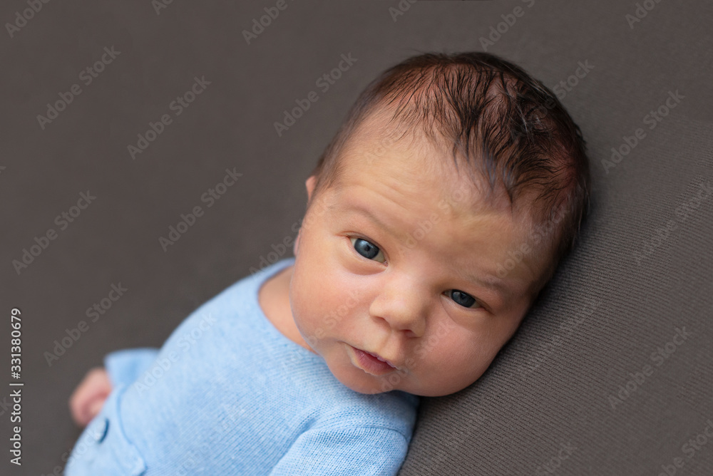 Newborn baby emotions, white background. Funny face of a child, emotions. Newborn baby emotions, white background. Funny face of a child, emotions.