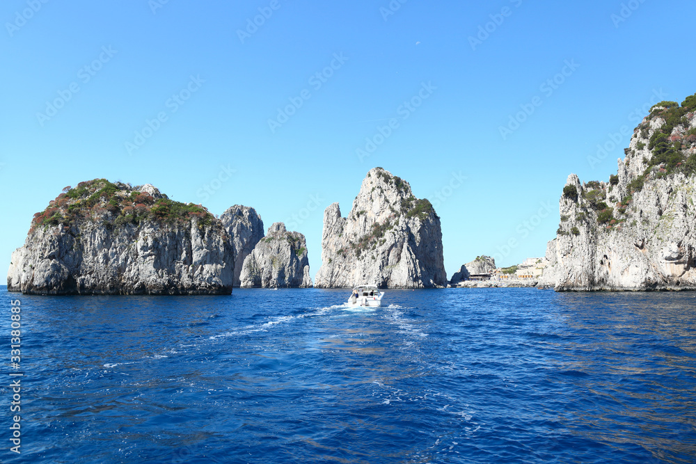 Capri , Italy: The famous Faraglioni rock stacks Capri , Italy: The famous Faraglioni rock stacks