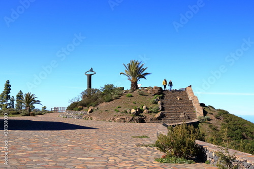 Monument of whistling language at the overlook Mirador de Igualero and the church Iglesia de San Francisco in the highland of La Gomera, Canary Islands, Spain photo