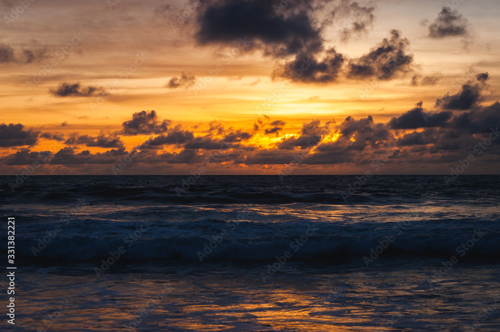 Obraz premium Magical dramatic sunset on a tropical beach.