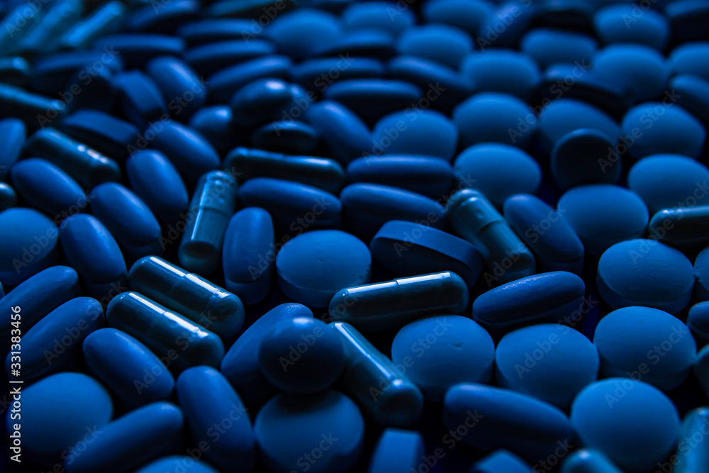 Obraz premium Blue white pills, tablets capsule. Color of the year concept.