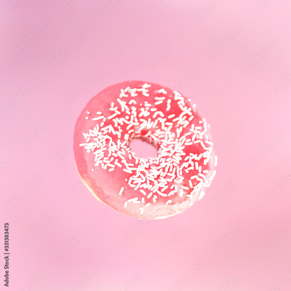Pink donut with white top on the pink background Pink donut with white top on the pink background