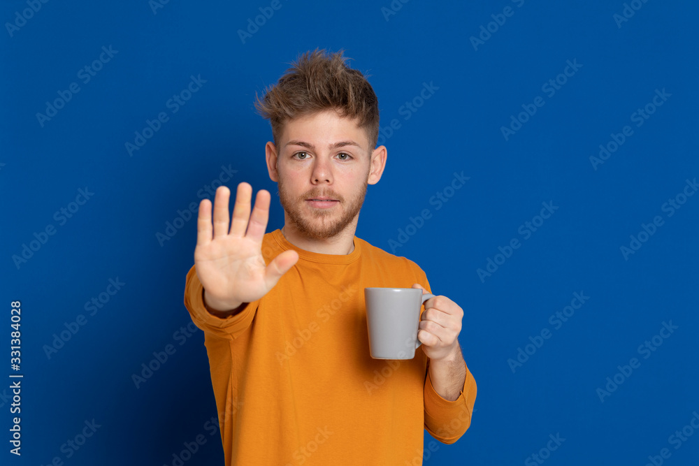Attractive young guy with a yellow T-shirt Attractive young guy with a yellow T-shirt