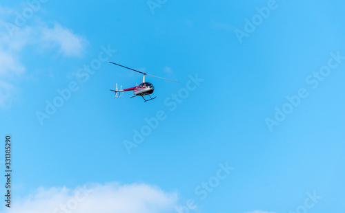Helicopter in the blue sky