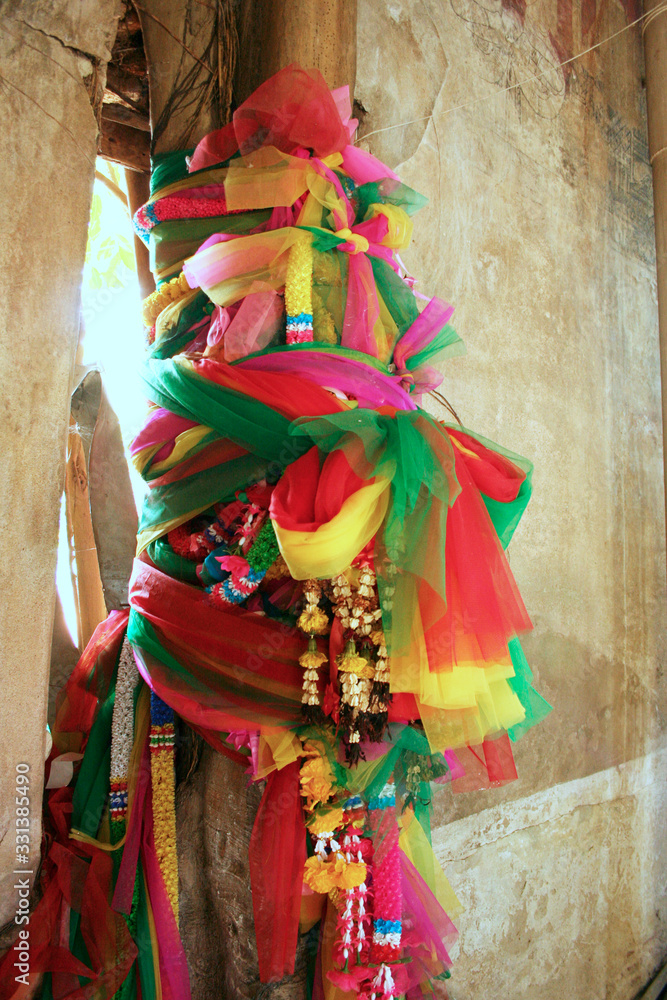 Tie fabrics three colors at tree for religion belief