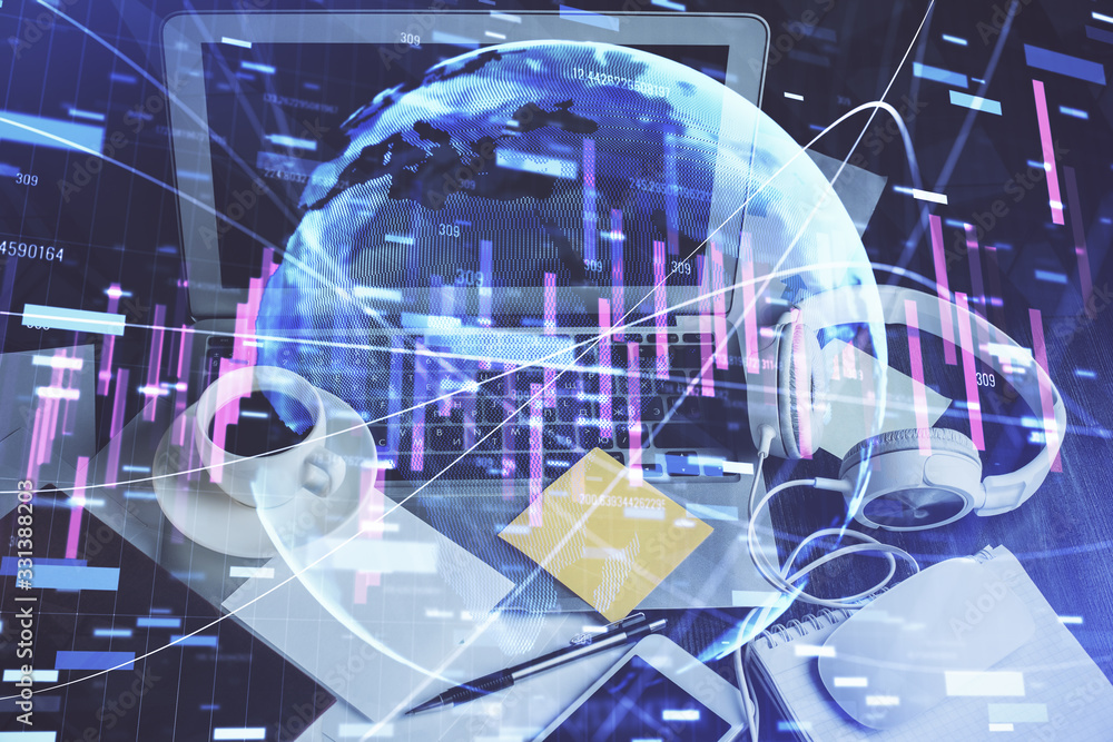 Double exposure of chart and financial info and work space with computer background. Concept of international online trading.