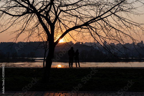 Couple enjoy sunset in the park