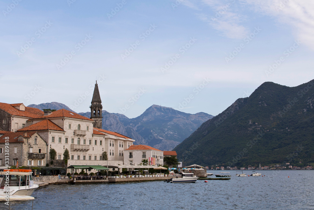 Coastal sea city on the background of mountains and sky. Perast. Montenegro.