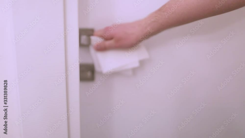 Hand safely opens the door, security measures during a pandemic Hand safely opens the door, security measures during a pandemic
