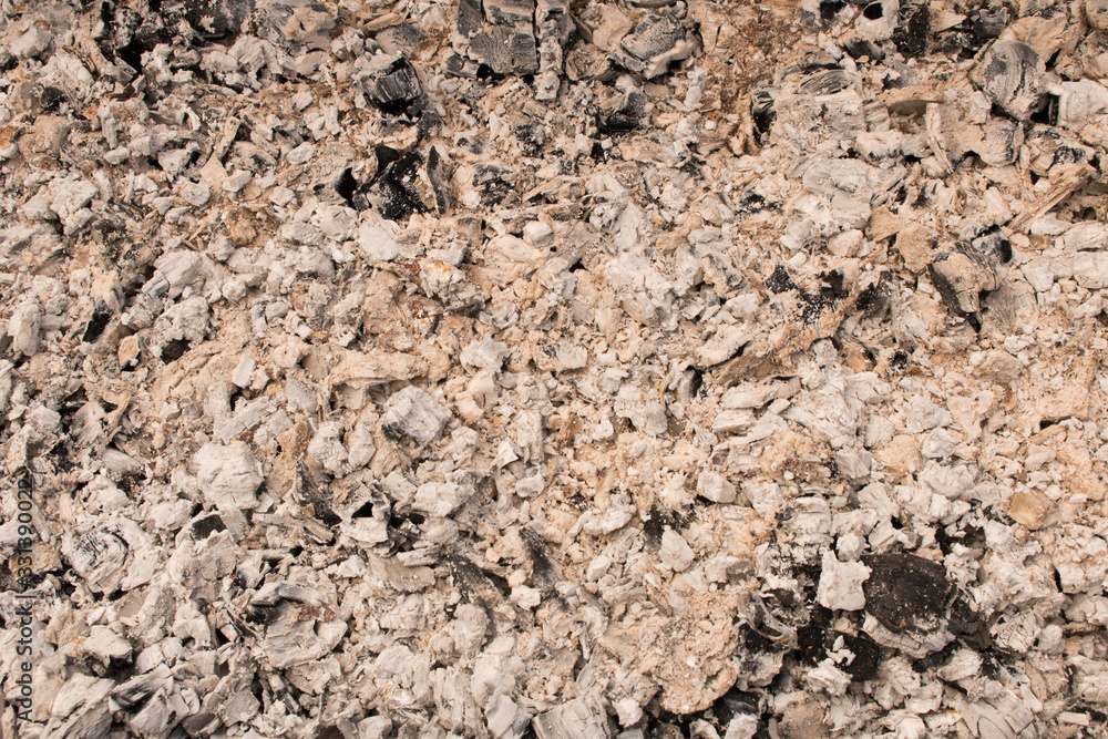Abstract background texture of burnt ash. Coals in an extinct fire. Selective focus. Abstract background texture of burnt ash. Coals in an extinct fire. Selective focus.