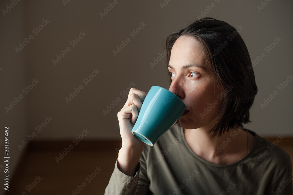 young peaceful happy woman drinking a beverage young peaceful happy woman drinking a beverage