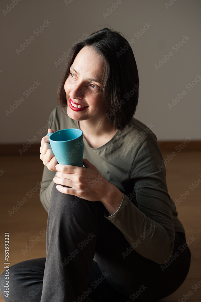 young peaceful happy woman drinking a beverage young peaceful happy woman drinking a beverage