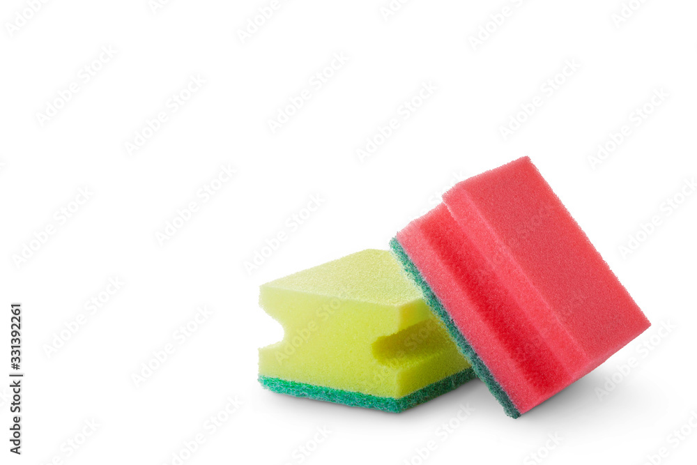 Red and yellow foam sponges for washing dishes closeup on a white background. Red and yellow foam sponges for washing dishes closeup on a white background.