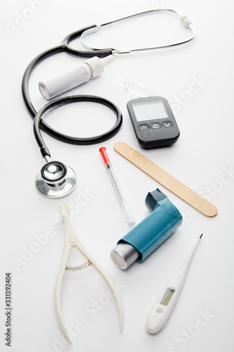 High angle view of medical objects on white