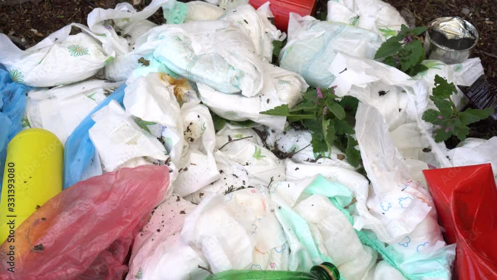 Used baby diapers garbage in a landfill. Dirty Nappies and Solid Waste