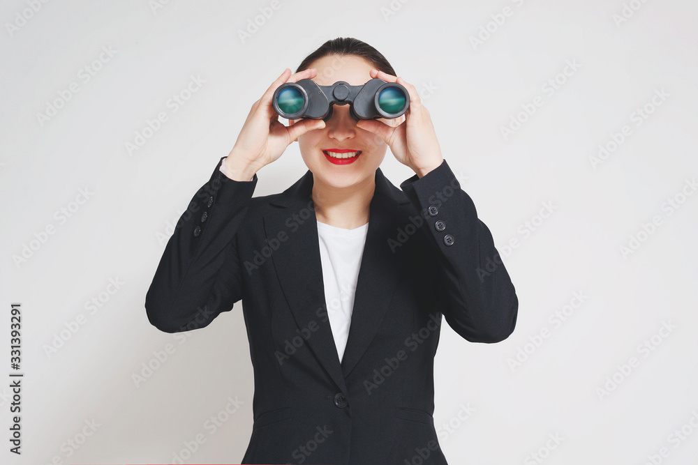 Conceptual shot of a mature businesswoman with big binoculars Conceptual shot of a mature businesswoman with big binoculars