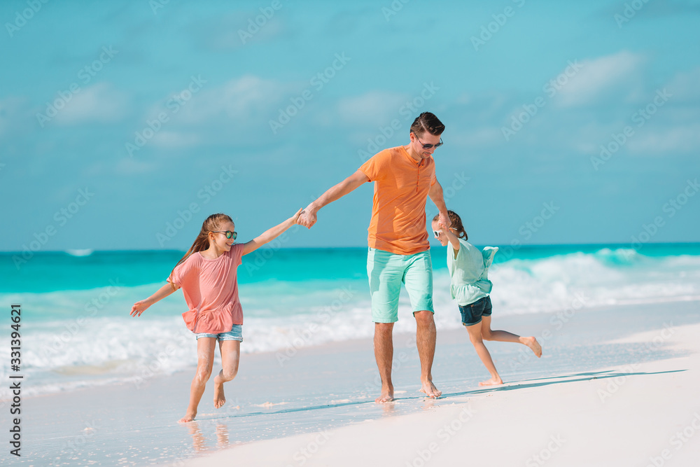 Father and kids enjoying beach summer vacation