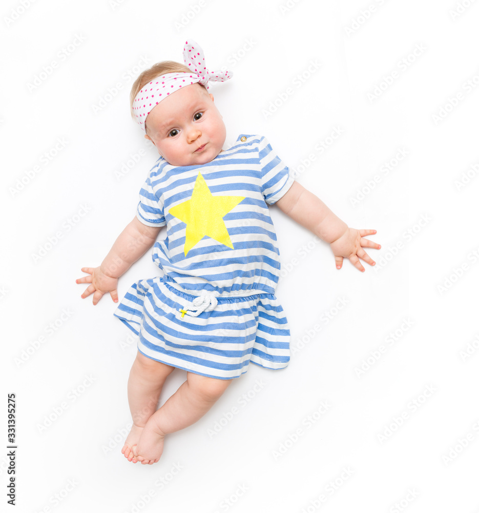 Portrait of a sweet infant baby girl wearing a pink dress and headband bow, isolated on white in studio Portrait of a sweet infant baby girl wearing a pink dress and headband bow, isolated on white in studio