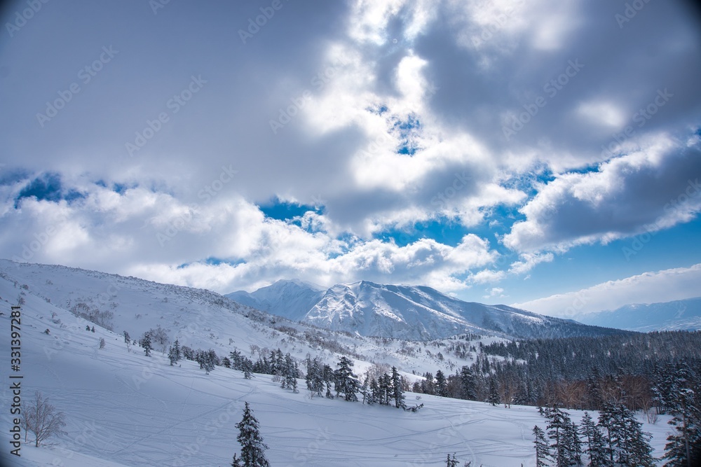 Japan's snow powder. Winter mountains panorama