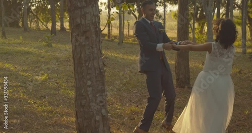 A newlywed couple dancing happily together photo