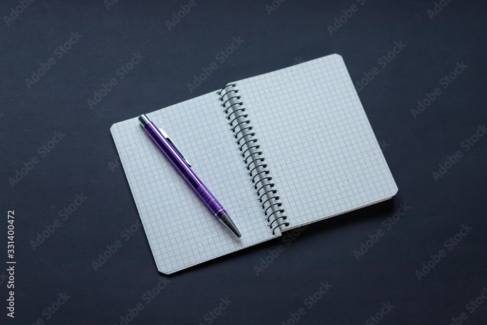 black background, coffee, notebook with pen and phone black background, coffee, notebook with pen and phone