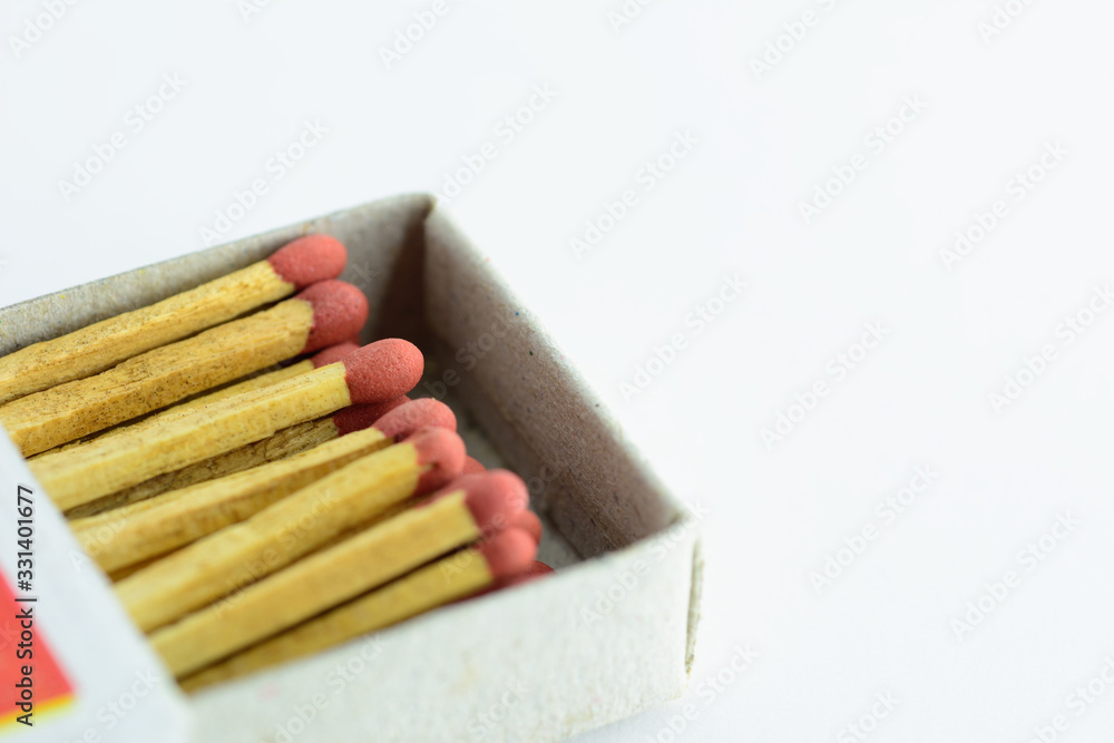 Matches in box isolated on white background.