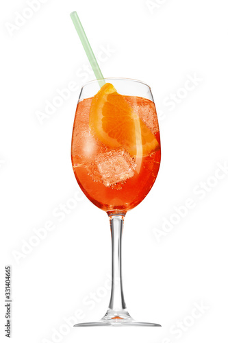 Aperol Spritz cocktail with a slice of orange, ice cubes and a green straw is contained in a high glass on the long stem. The bright illustrative picture is made on the white background.
