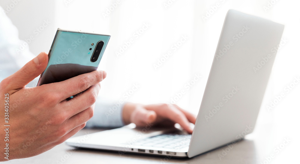 man in office holding phone isolated