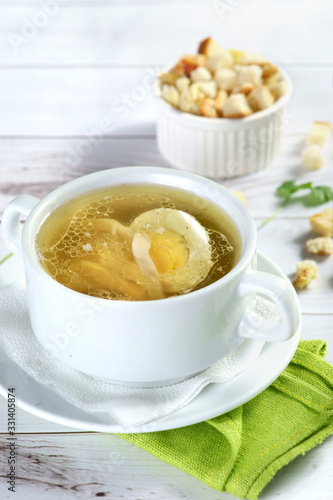 chicken broth with egg and crackers