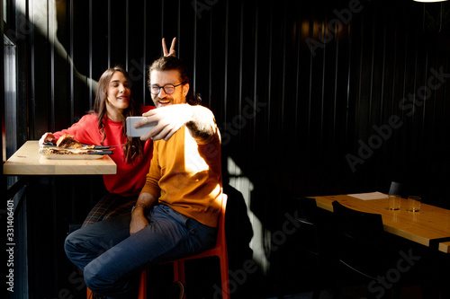 Two young people in Fast Food Restaurant 
