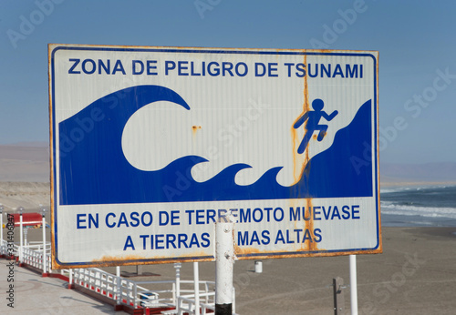 At the beach of Illo Peru. Sign Tsunami warning. Peligro de Tsunami. Coast and beach.