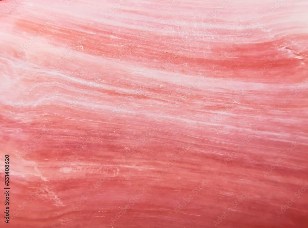 Beautiful soft pink texture with white streaks, similar to the texture of stone, marble, soap. Close up