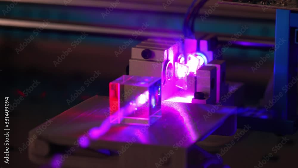 Experiments with a laser system in the laboratory. Beam of RGB laser on ...