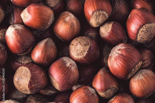 Hazelnuts. Stack of hazelnuts. Food background. Hazelnuts texture. Top view