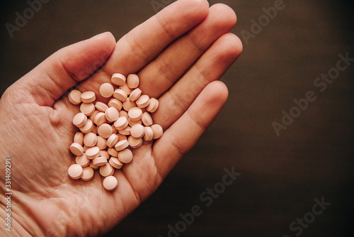 full hand of pills for viral diseases