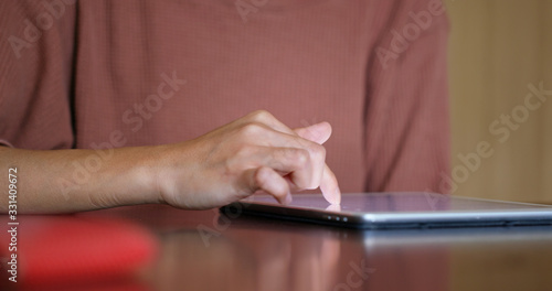 Woman use of tablet on table