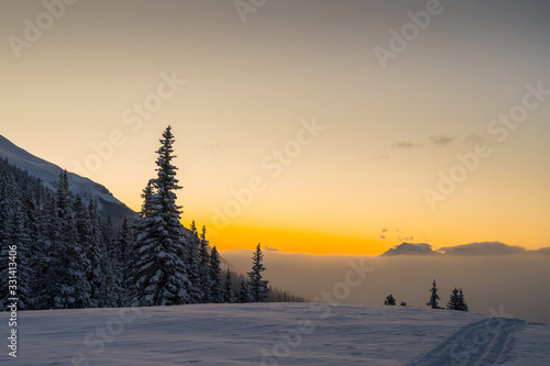 Beautiful morning panorama from Lake Louise ski area looking donw into the valley during an epic colorful winter sunrise. Banff national park in the early hours. photo