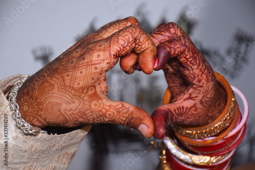 Heart shaped, Indian matrimonial tradition made by the hands of a newly married couple.
