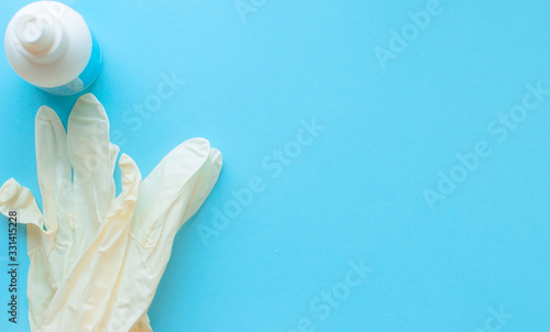 medical gloves, protective antibacterial antiseptic on a blue background. Coronavirus, flu virus outbreak, epidemic panic, pandemic
