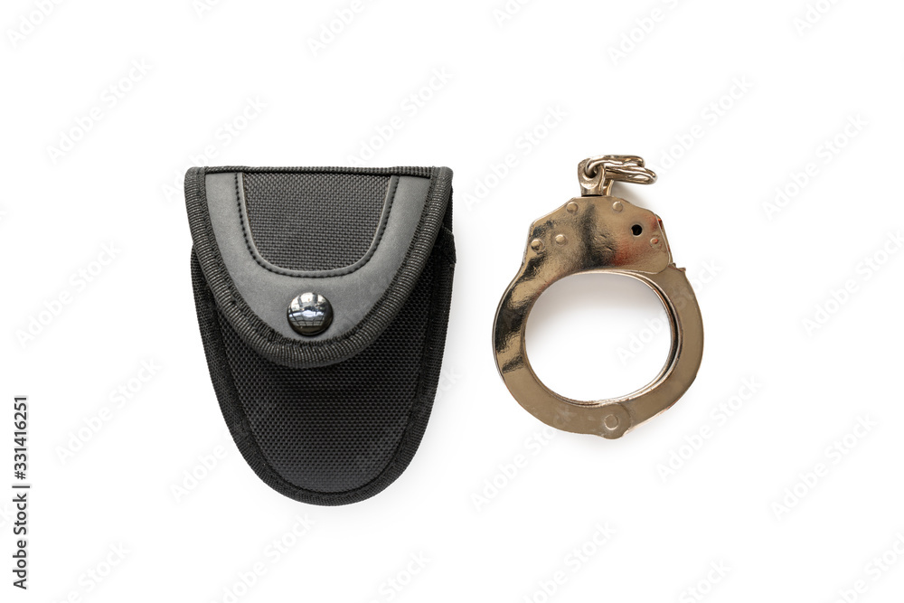 Obraz premium Handcuff and bag isolated on white background