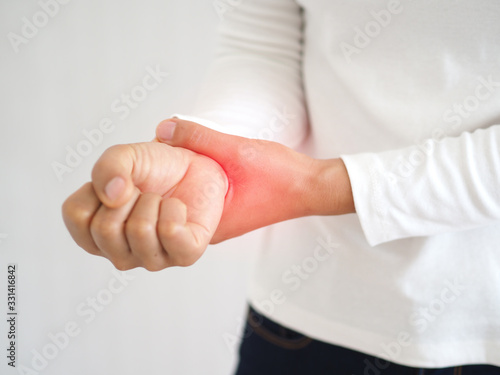 Obraz na plátně rheumatoid arthritis and repetitive motion injuries,including carpal tunnel syndrome in woman and she touching on her wrist and symptoms of pain and swelling in the hand use for health care concept