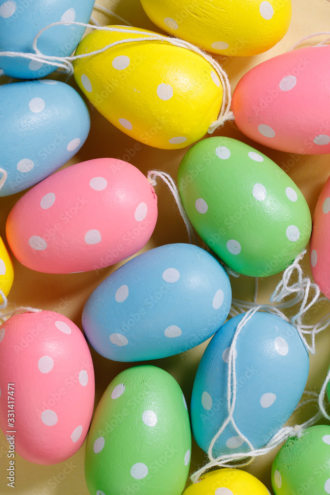 Easter background. Flat lay. Background from bright Easter eggs of different colors. Handmade painted eggs. Close-up, vertical, cropped shot. Easter concept. Easter background. Flat lay. Background from bright Easter eggs of different colors. Handmade painted eggs. Close-up, vertical, cropped shot. Easter concept.